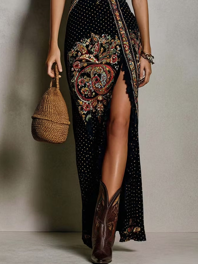 Long black bohemian-style dress with an ethnic print, deep V-neck and high slit.